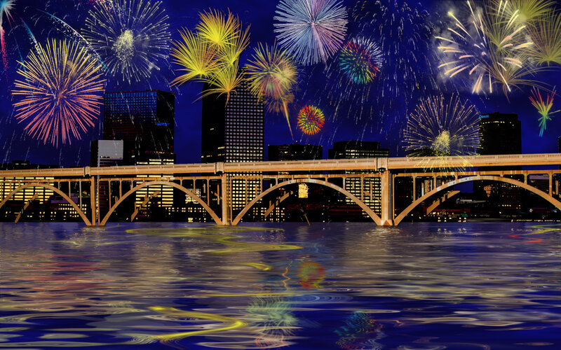 Fireworks over city bridge