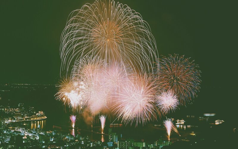 Fireworks over City — Green, Festive, Night