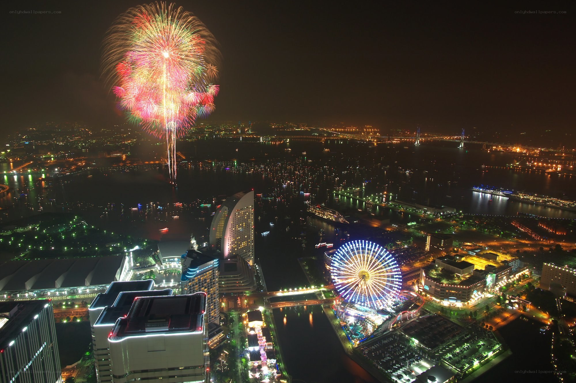 Fireworks over city harbor
