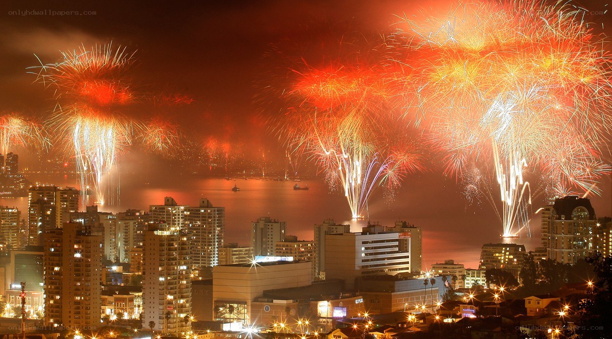 Fireworks over city harbor