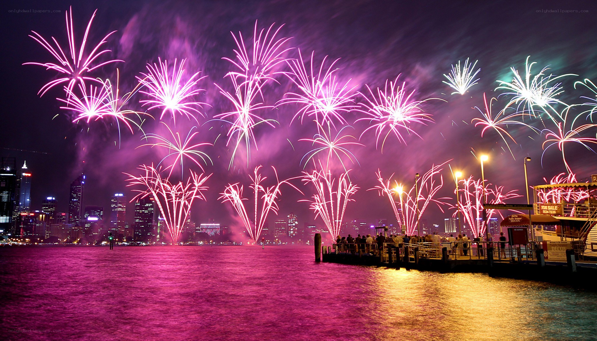 Fireworks over city harbor
