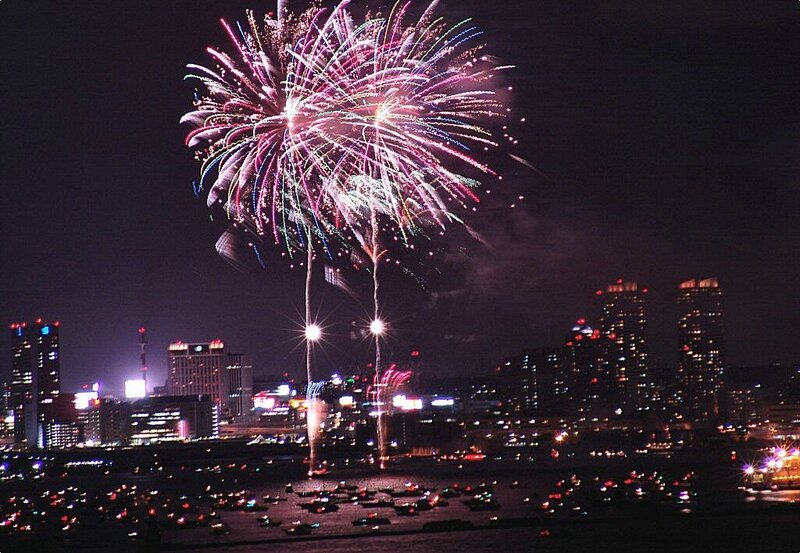 Fireworks over city harbor
