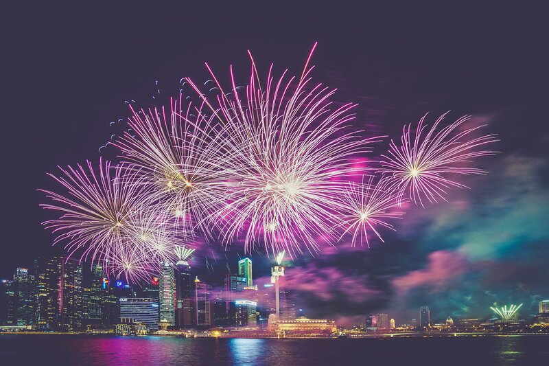 Fireworks over City — Purple, Celebratory, Night, Photograph, City Skyline