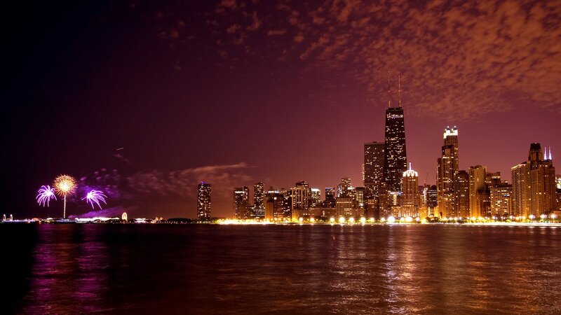 Fireworks over City Skyline — Purple