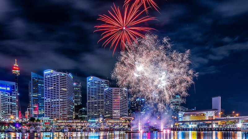 Fireworks over City Skyline — Red