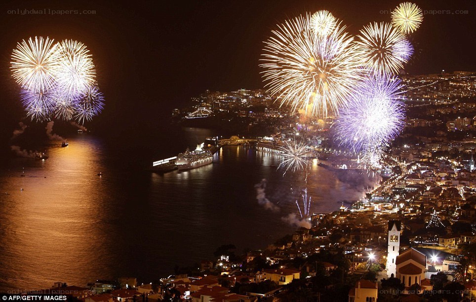 Fireworks over coastal city