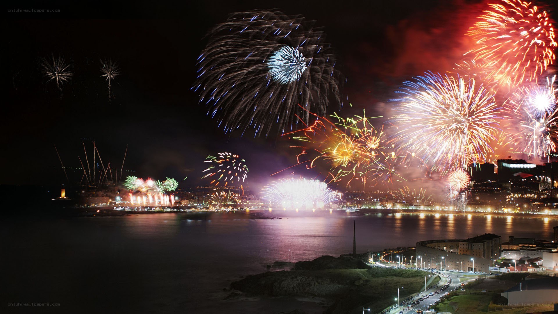 Fireworks over coastal city