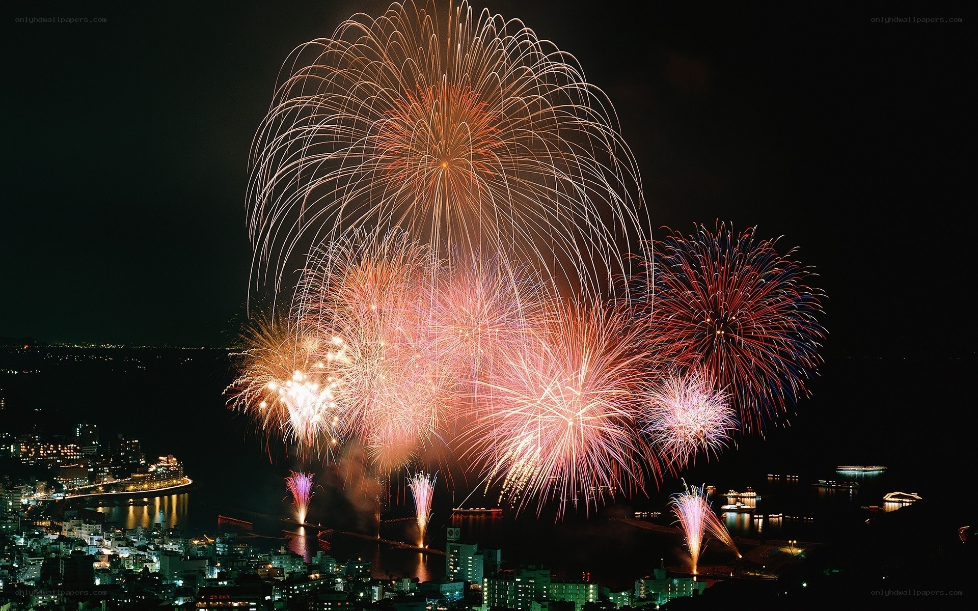 Fireworks over coastal city