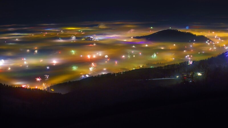Fireworks over Foggy Hills