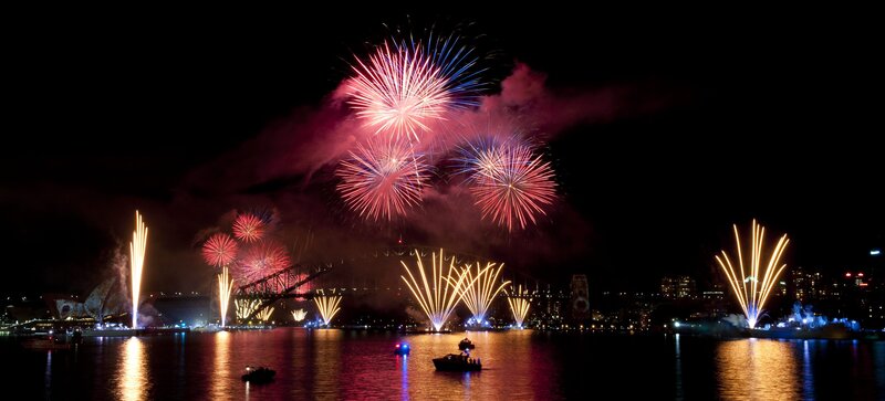 Fireworks over Harbor — Red, Festive, Night, Photograph, Bridge