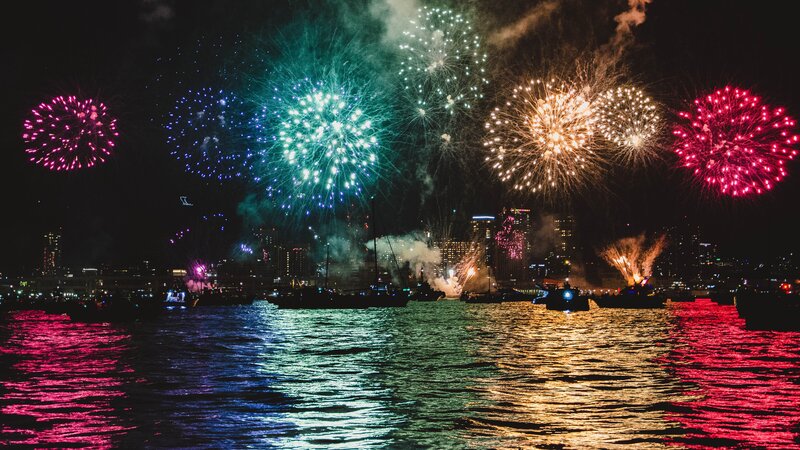 Fireworks over Harbor — Red, Festive, Night, Photograph, City Skyline