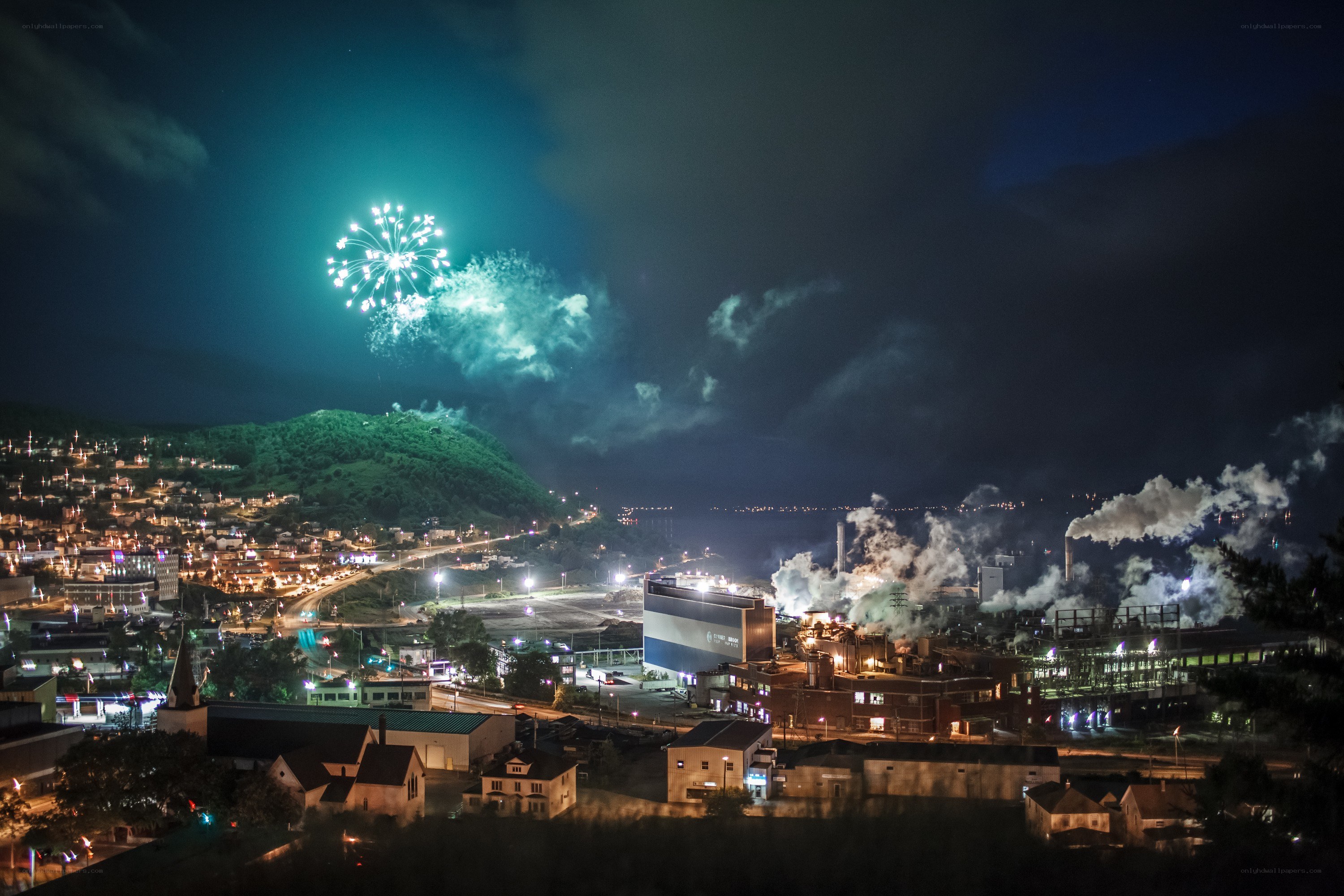Fireworks over industrial town