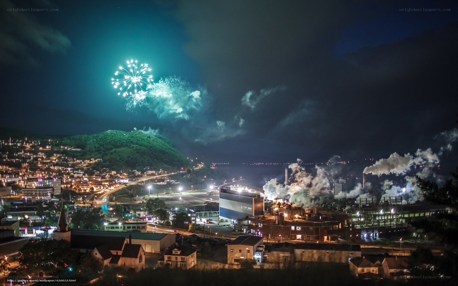 Fireworks over industrial town