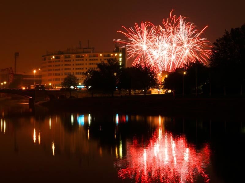 Fireworks over River — Red, Celebratory