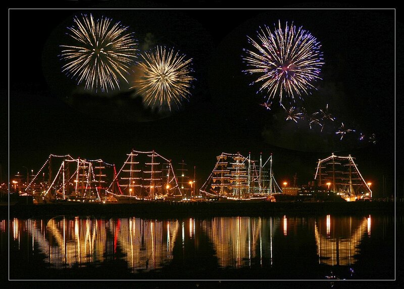Fireworks over ships at night