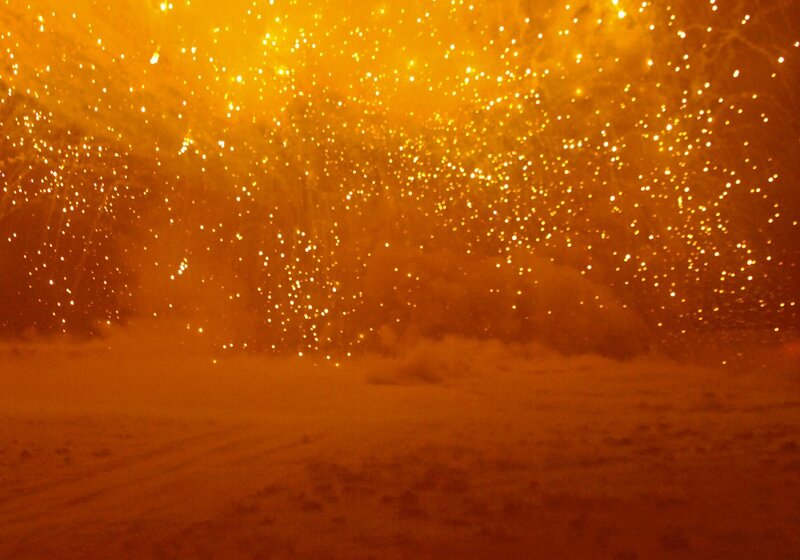 Fireworks over snowy landscape
