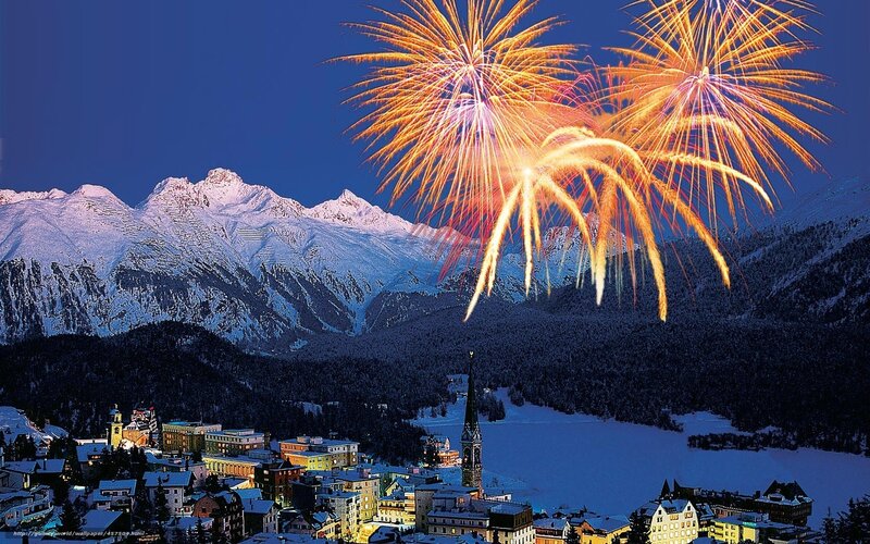 Fireworks over snowy mountains