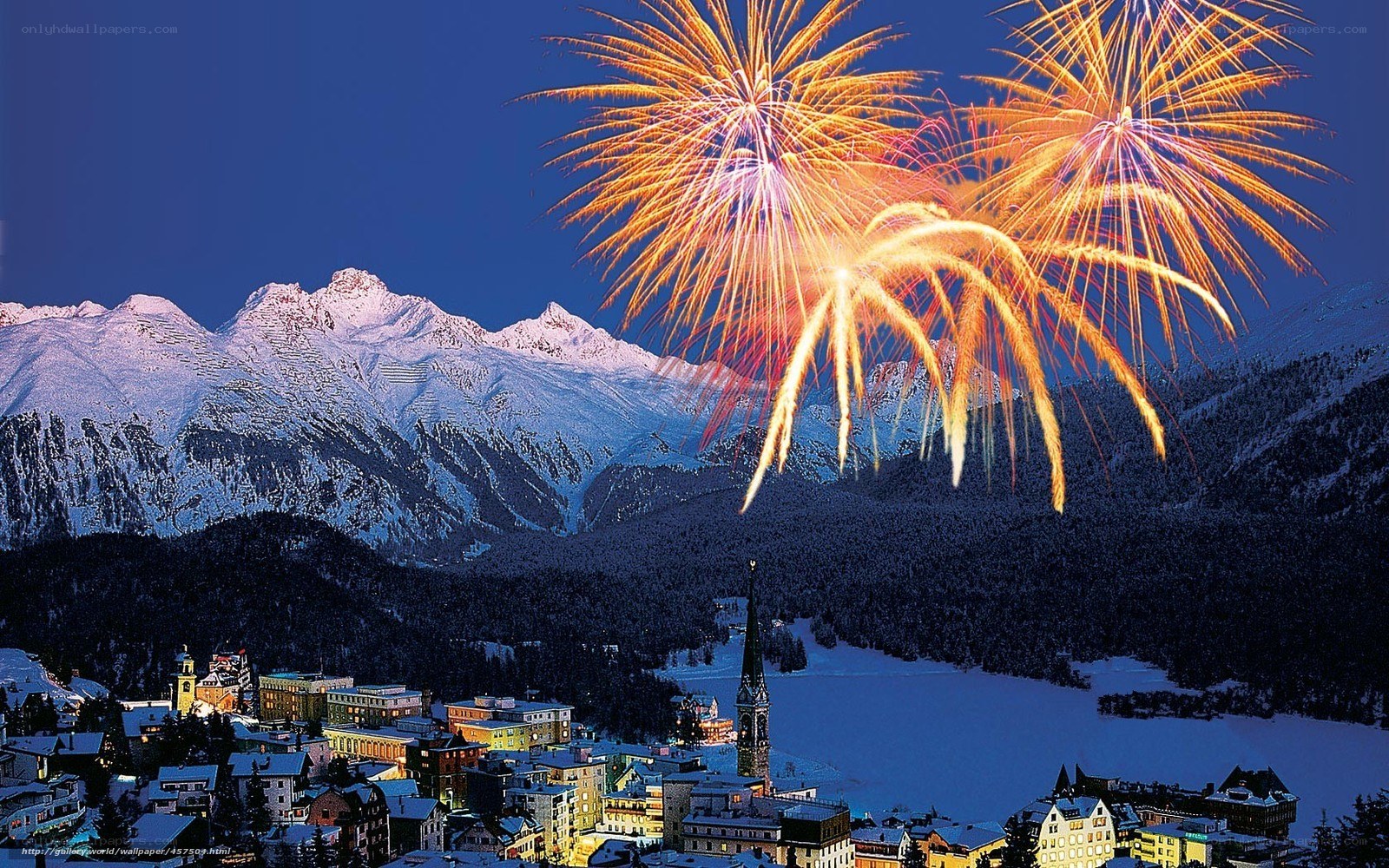 Fireworks over snowy mountains