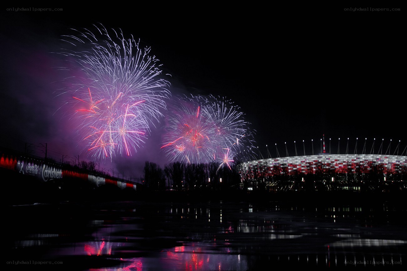 Fireworks over stadium at night