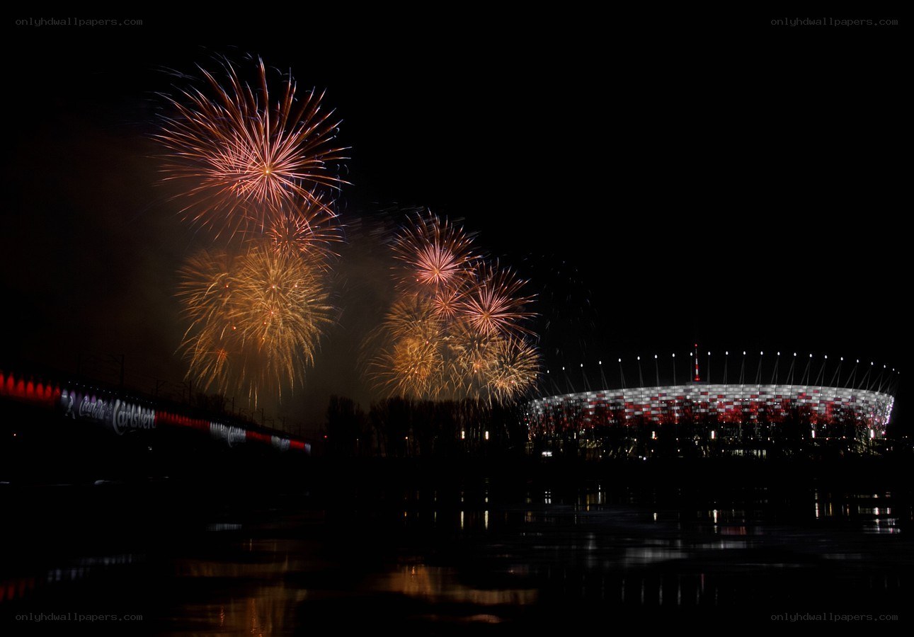 Fireworks over stadium at night