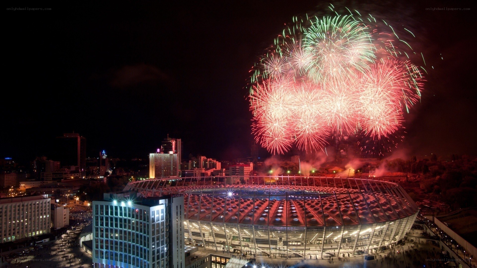 Fireworks over stadium at night