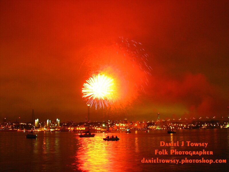 Fireworks over Water — Red, Dramatic, Night, Photograph, City Skyline