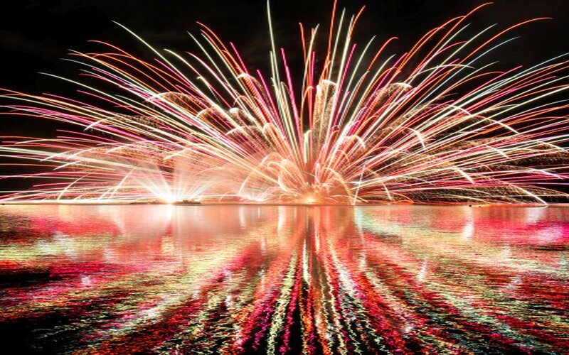 Fireworks over Water — Red, Dramatic