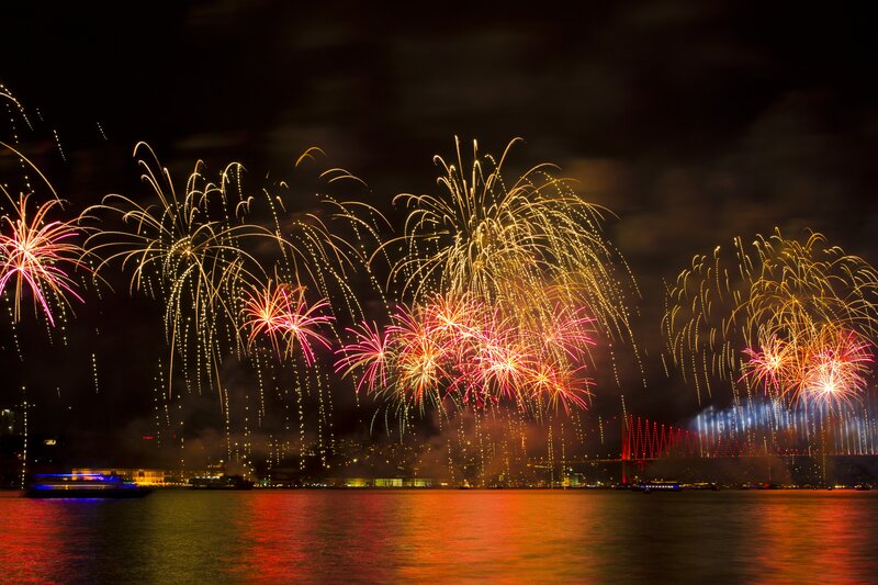Fireworks over Water — Red, Festive, Night, Photograph, Bridge