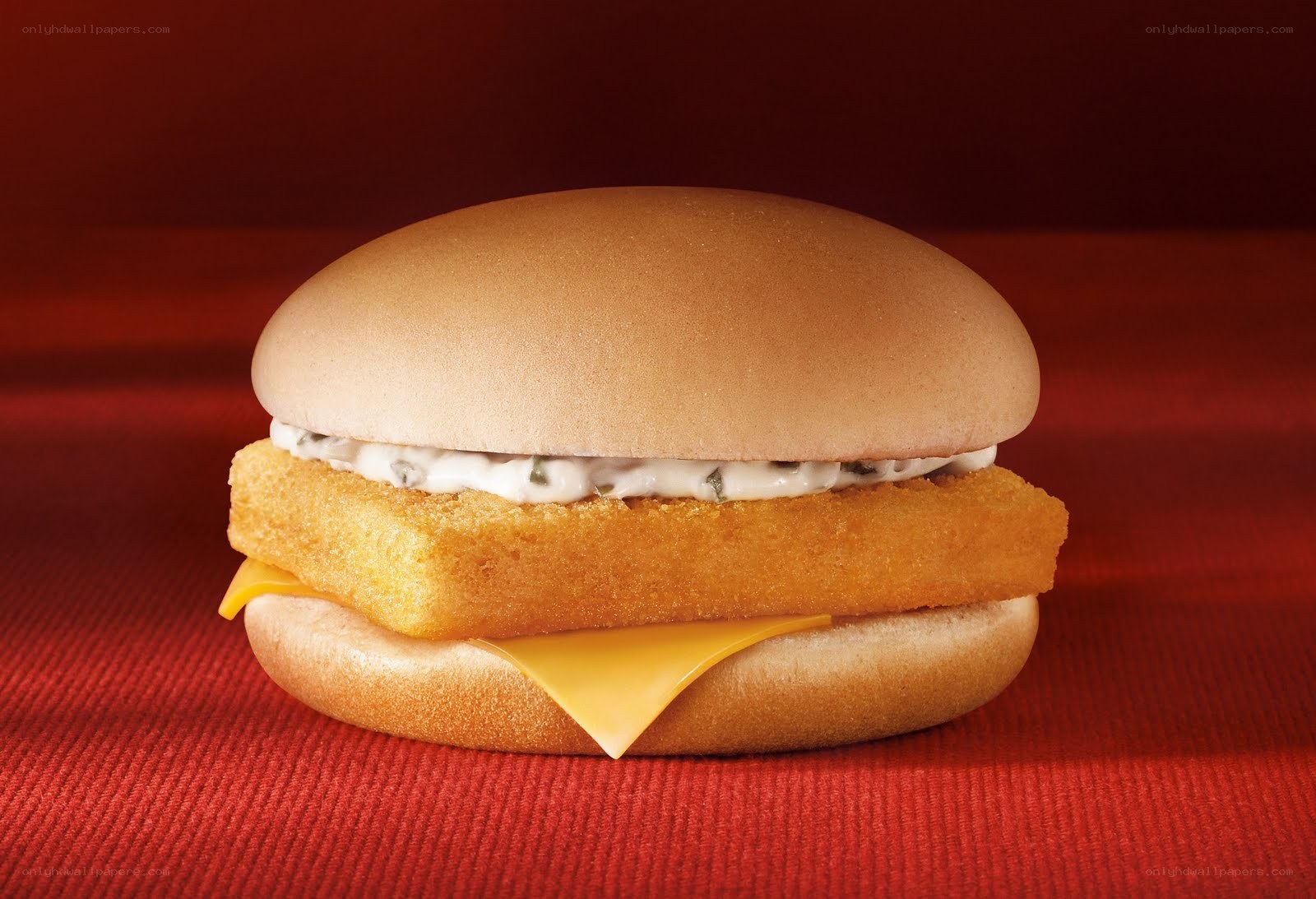 fish burger on red surface
