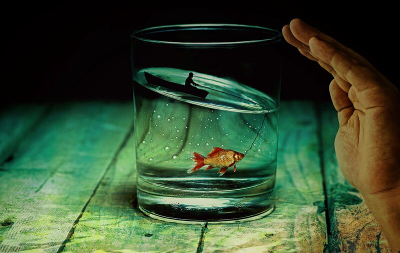 Fish in a glass with fishing scene