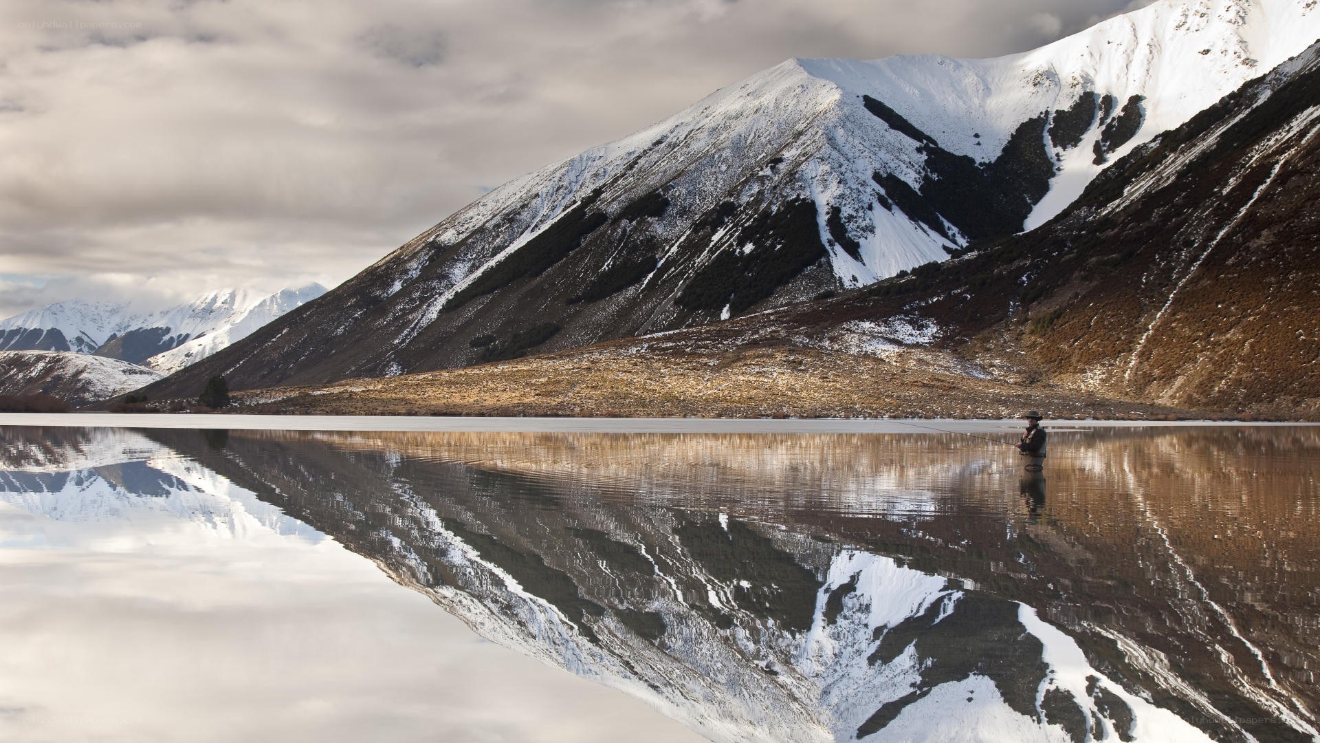 Fisher on a mountain lake