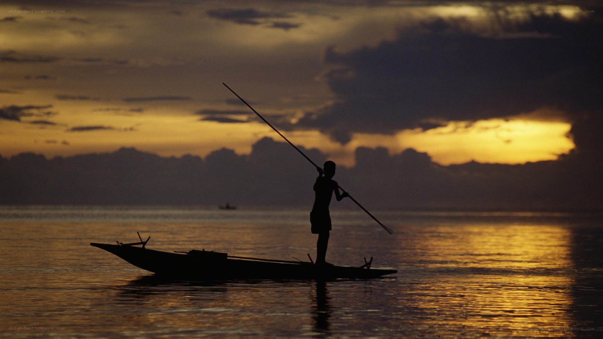 Fisherman at sunset silhouette