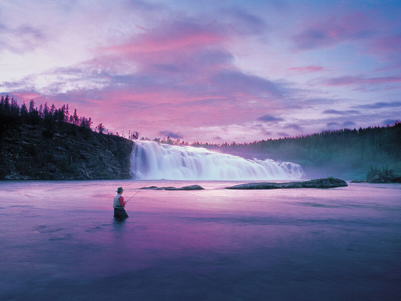 Fisherman at Waterfall