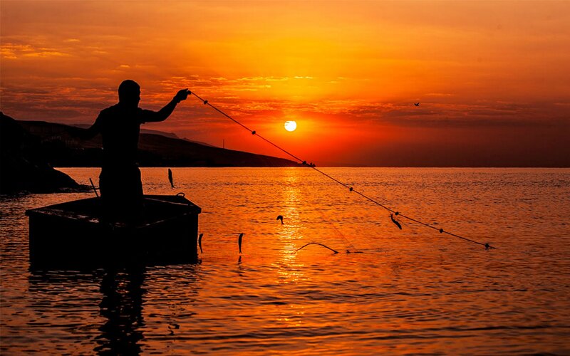 Fisherman Casting Net — Orange, Dramatic