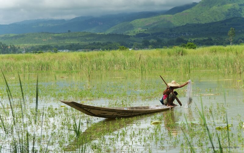 Fisherman in a boat on a lake