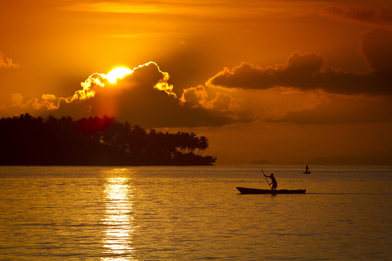 Fisherman in a Boat — Orange, Serene, Sunset