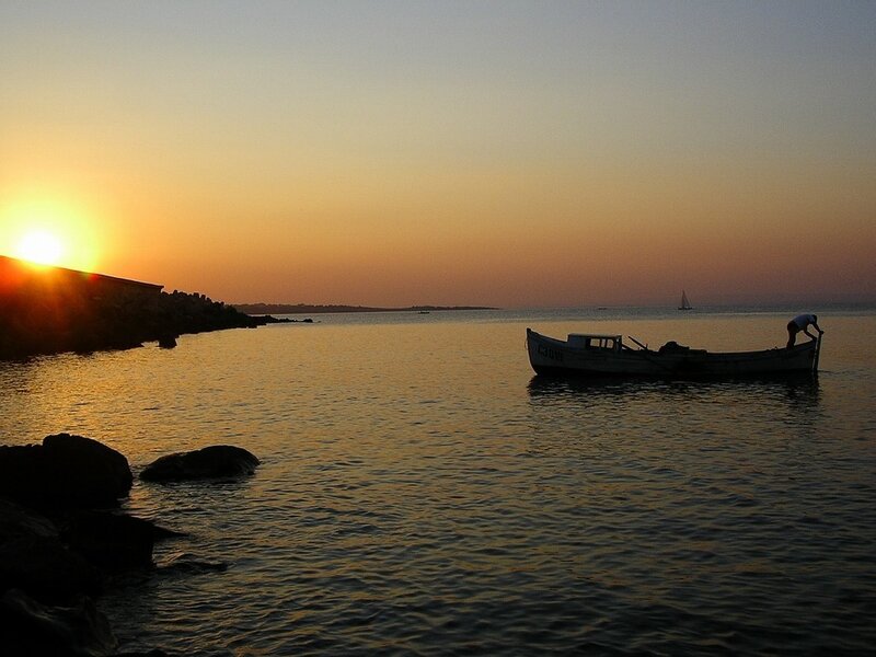 Fisherman in Boat — Orange, Serene, Sunset, Photograph, Sailboat