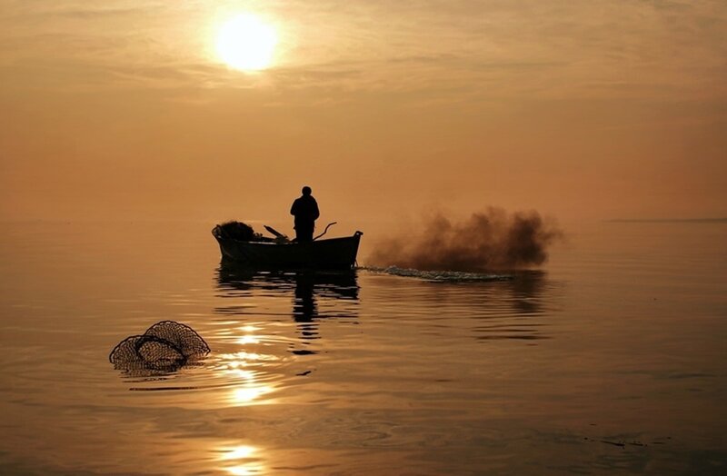 Fisherman in Boat — Orange, Serene, Sunset