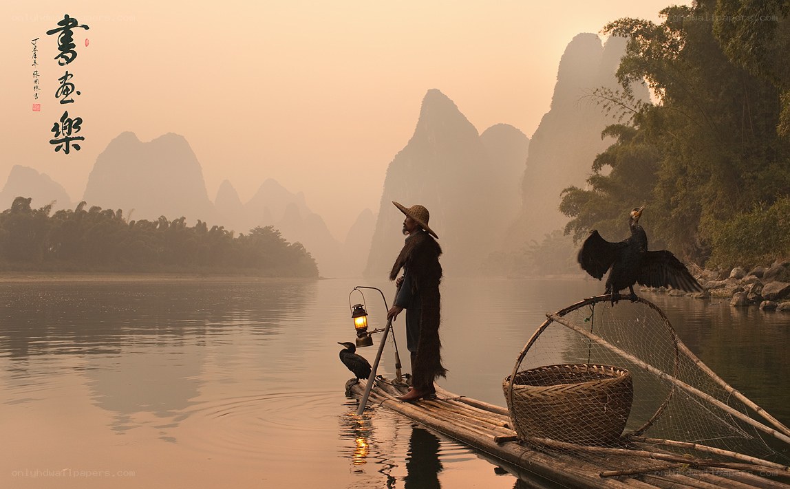 Fisherman on a bamboo raft