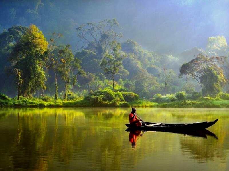 Fisherman on a calm river
