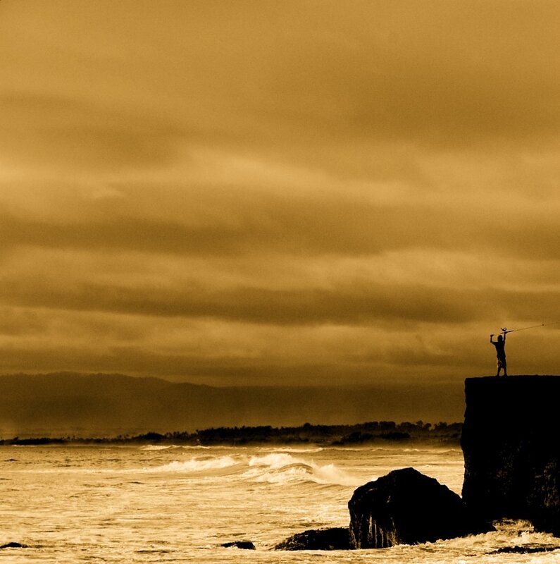 fisherman on a cliff