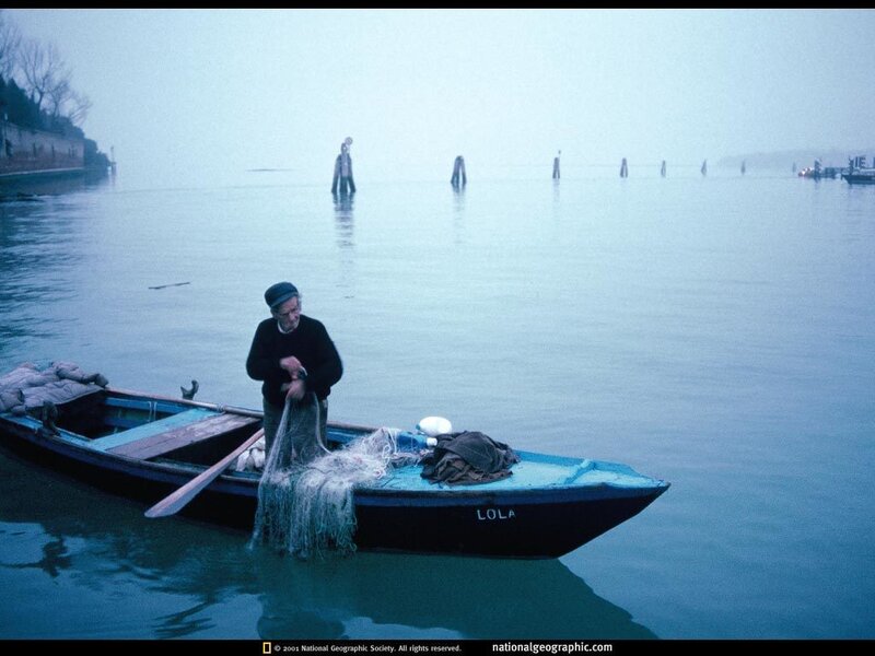 Fisherman on a misty morning