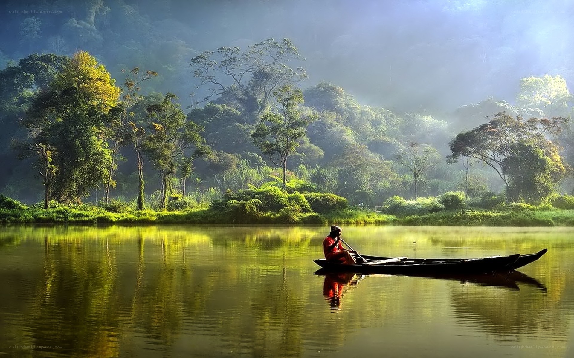 Fisherman on a misty river