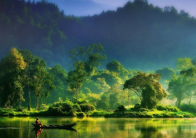 Fisherman on a misty river