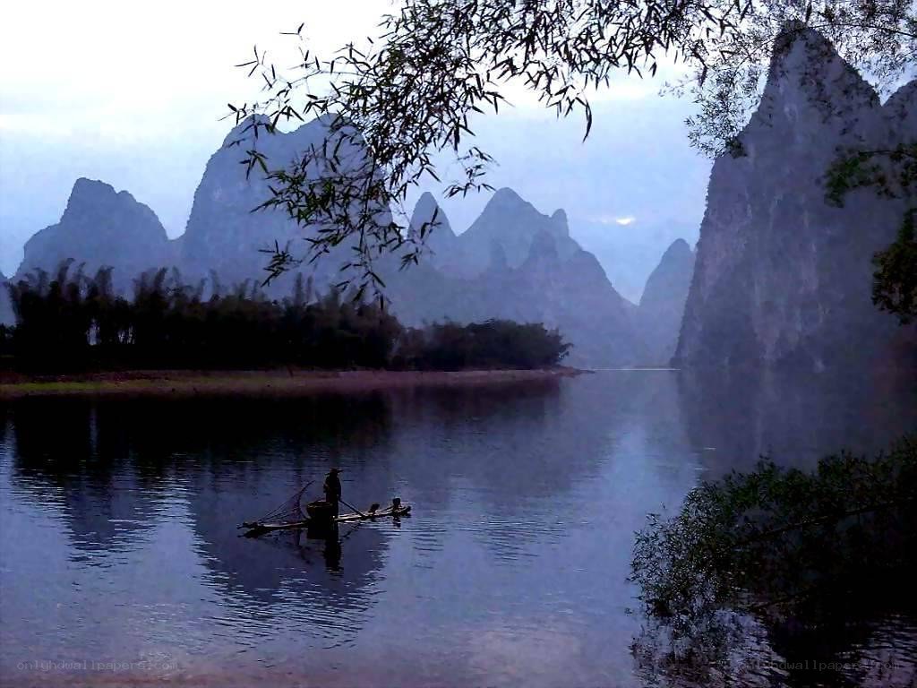 Fisherman on a misty river
