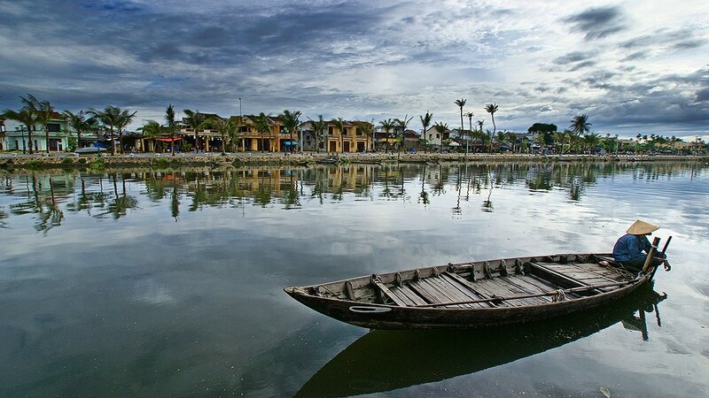 Fisherman on a river in Hoi An