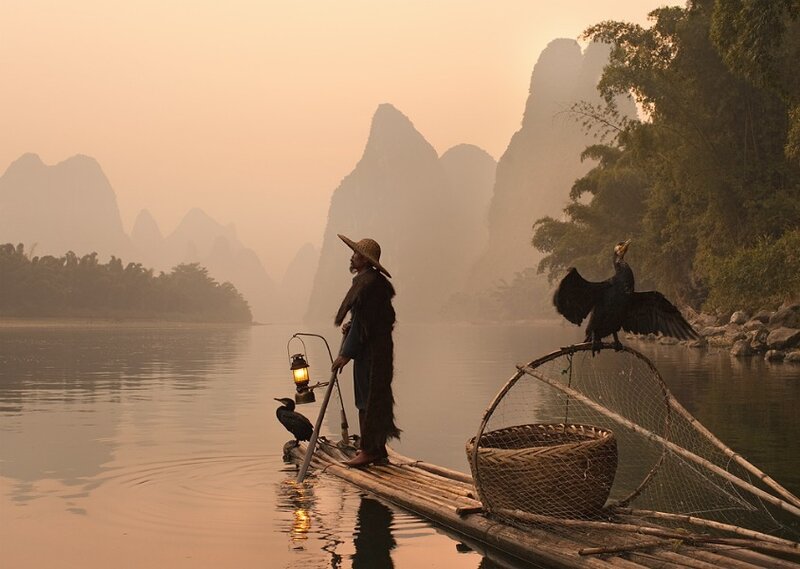 Fisherman on Bamboo Raft — Orange