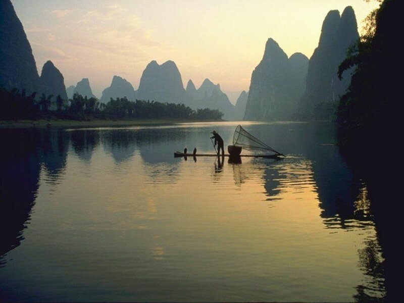 Fisherman on Bamboo Raft