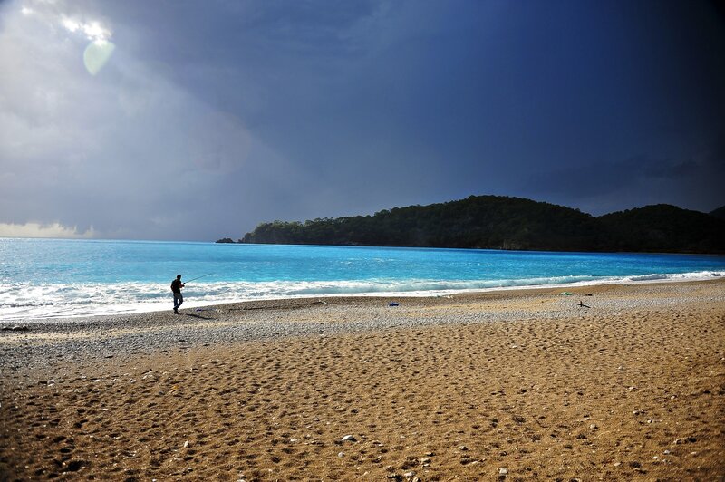 Fisherman on Beach — Blue, Dramatic, Afternoon