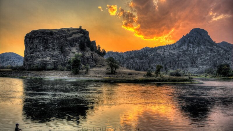 Fisherman on Riverbank — Orange, Dramatic